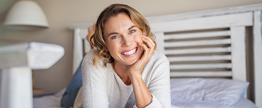 Mature woman smiling after vaginal tightening surgery in Manhattan